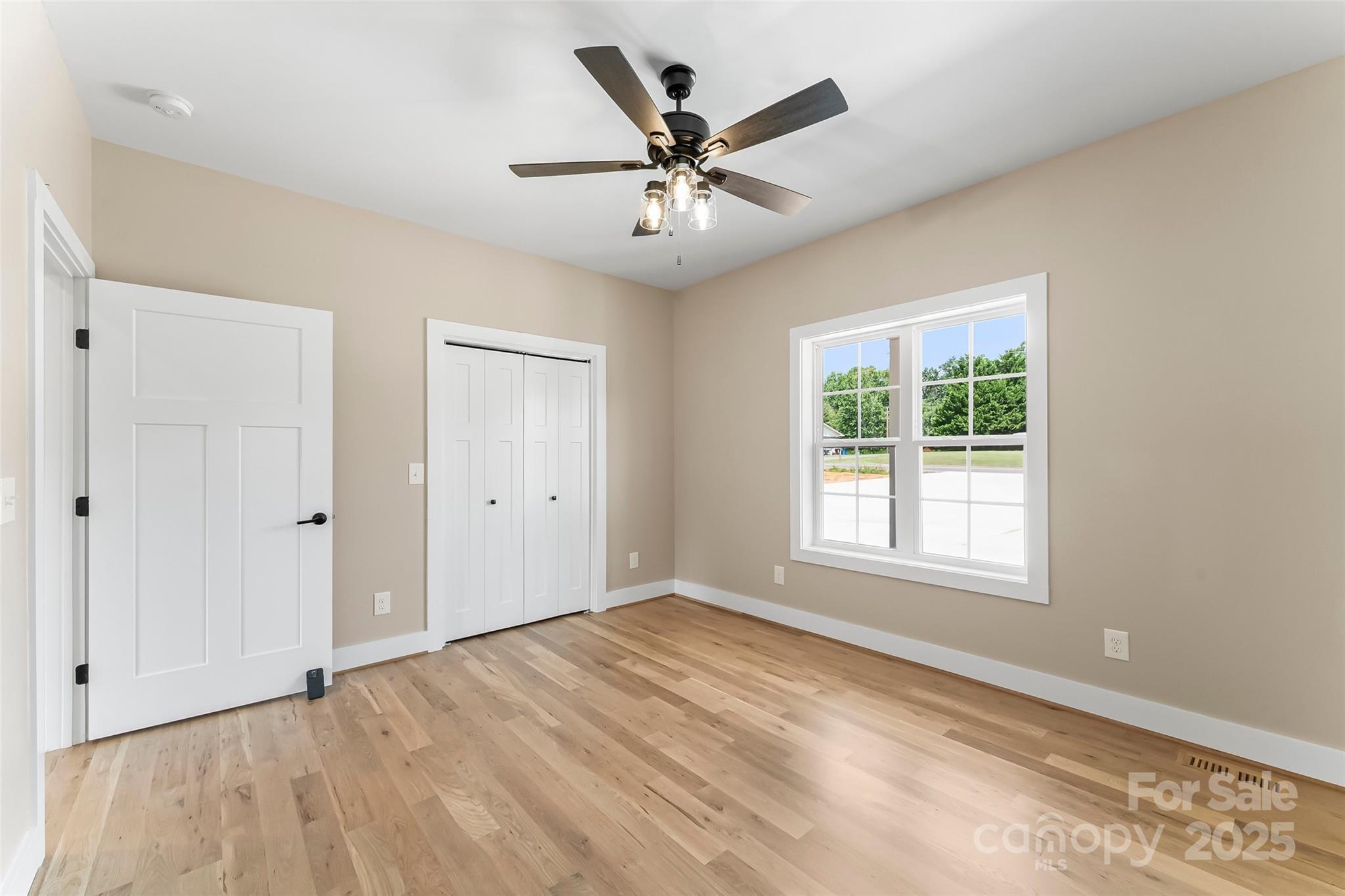 2937 Frank Whisnant Road Morganton, NC 28655 - Photo 14 of 25 a view of an empty room with wooden floor and a window