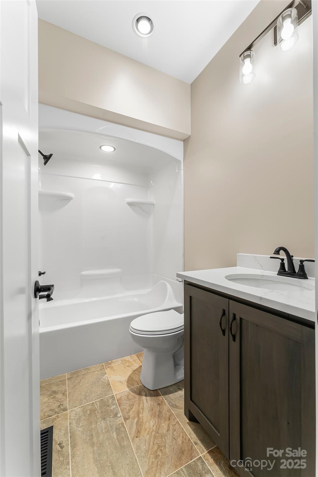 2937 Frank Whisnant Road Morganton, NC 28655 - Photo 16 of 25 a bathroom with a sink a toilet and shower