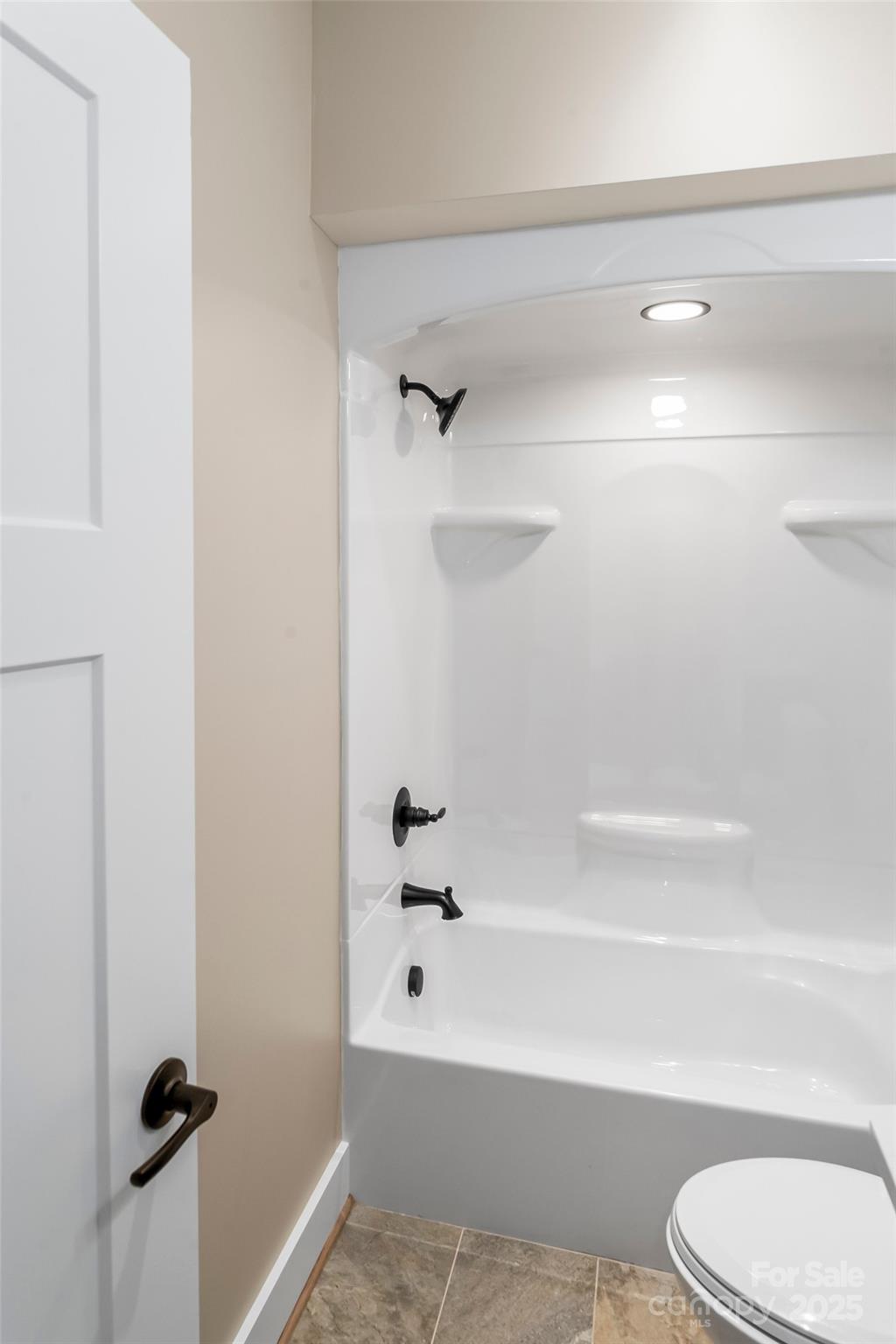 2937 Frank Whisnant Road Morganton, NC 28655 - Photo 17 of 25 a bathroom with a shower and a toilet