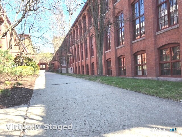 839 Main Street, Unit 91 Torrington, CT 06790 - Photo 2 of 14 a view of a building with a street