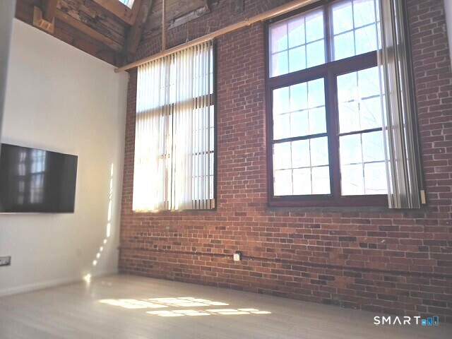 839 Main Street, Unit 91 Torrington, CT 06790 - Photo 4 of 14 a view of door and bedroom