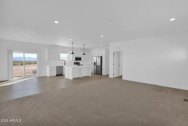 a bathroom with a sink a toilet and a window