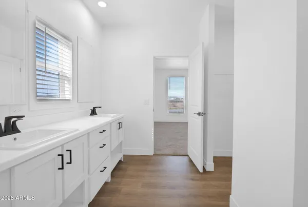 a bathroom with a sink a mirror and a shower