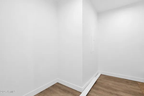 a bathroom with double vanity sink a mirror and a window