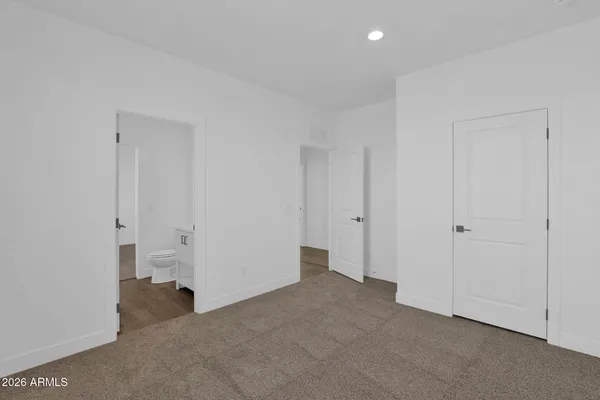 a view of an empty room and a window