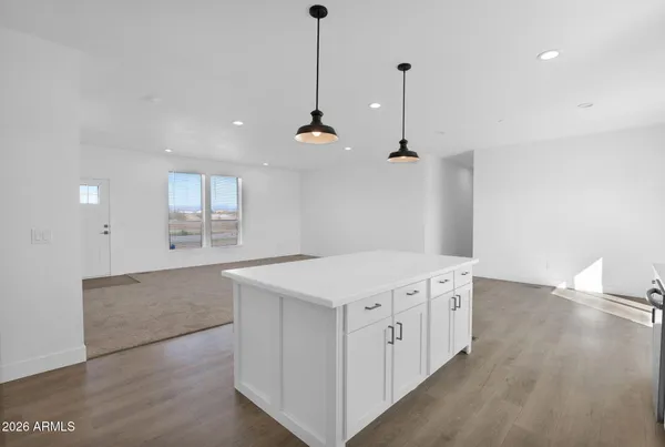 a kitchen with stainless steel appliances a stove microwave and sink
