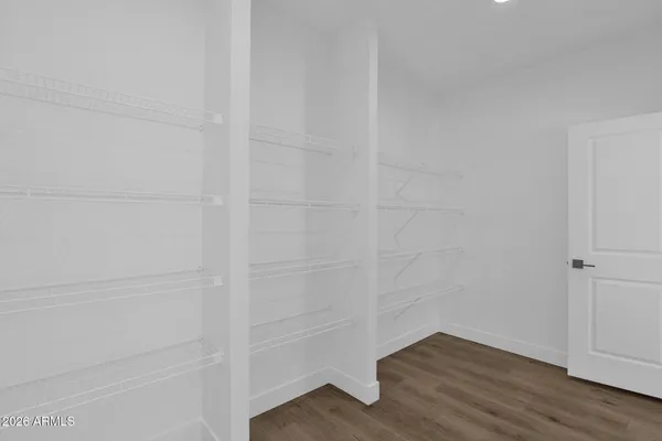 a kitchen that has a lot of cabinets in it