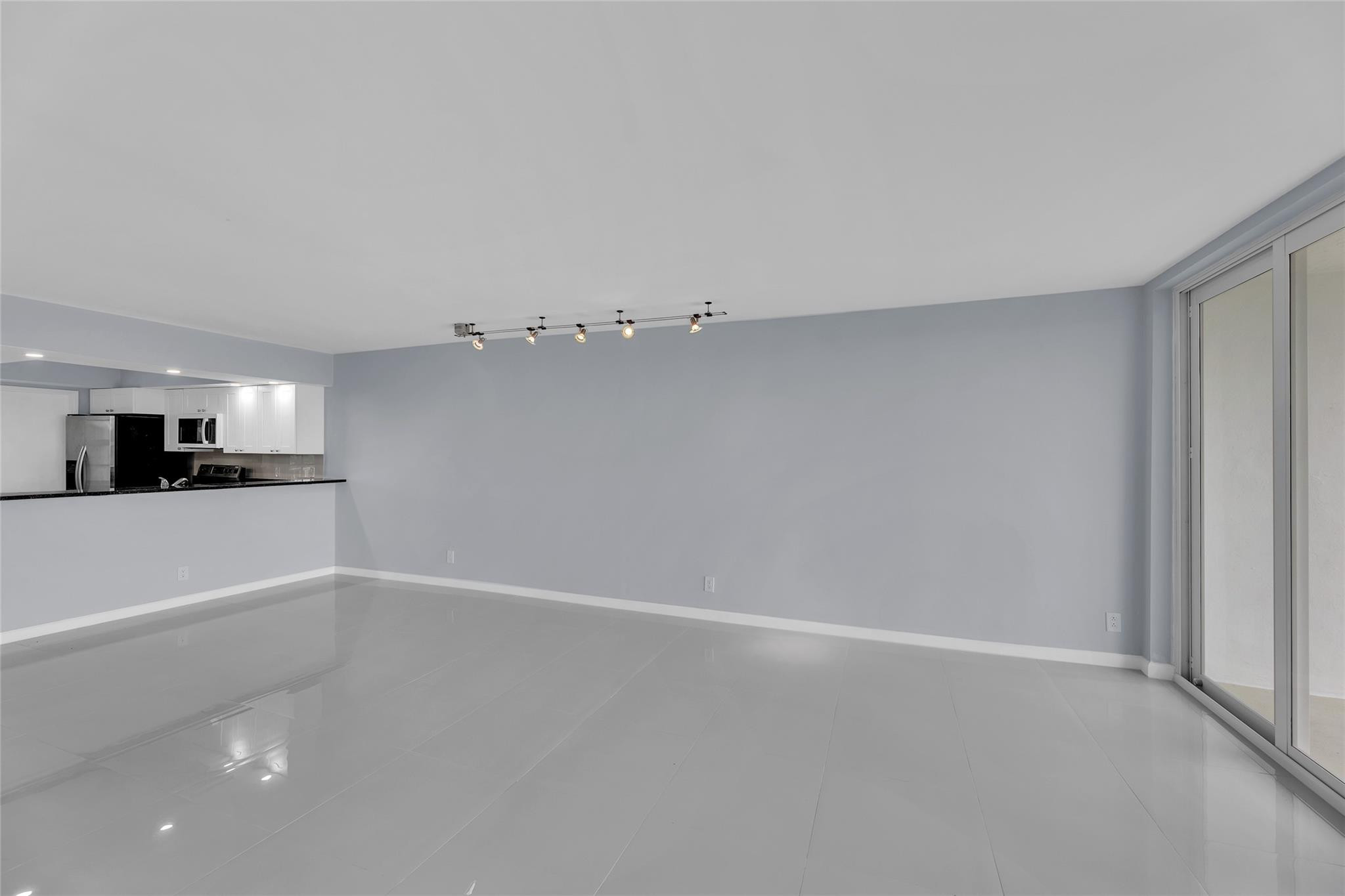 3090 North Course Drive, Unit 609 Pompano Beach, FL 33069 - Photo 12 of 44 a view of a kitchen with an empty space