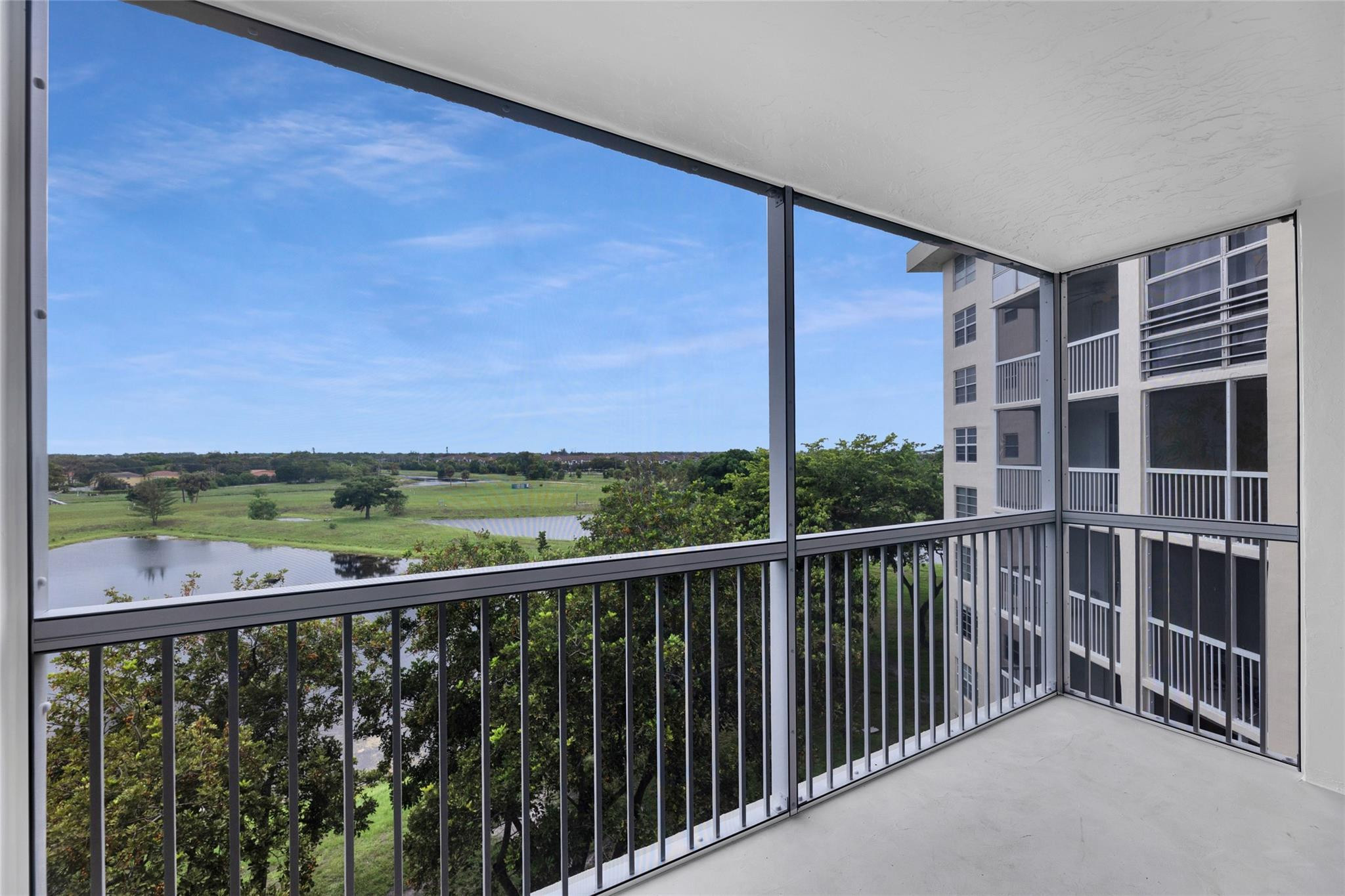 3090 North Course Drive, Unit 609 Pompano Beach, FL 33069 - Photo 20 of 44 a view of a balcony with an outdoor space