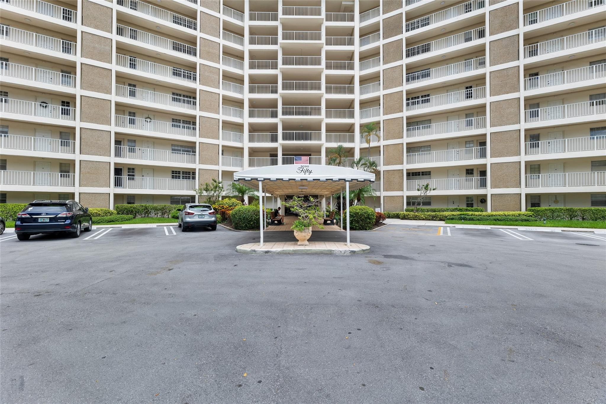 3090 North Course Drive, Unit 609 Pompano Beach, FL 33069 - Photo 38 of 44 a view of building with cars parked