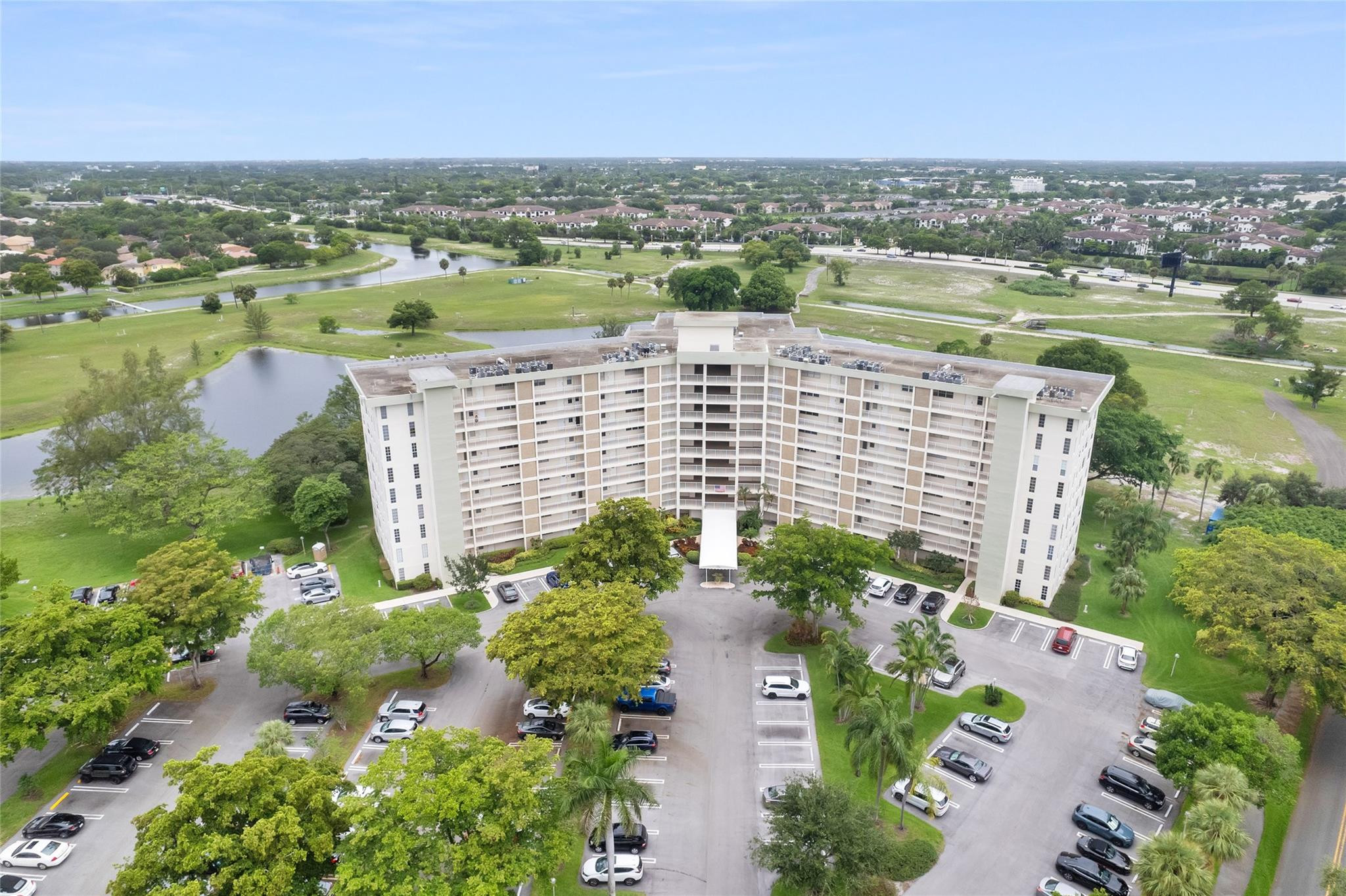 3090 North Course Drive, Unit 609 Pompano Beach, FL 33069 - Photo 42 of 44 an aerial view of city and lake
