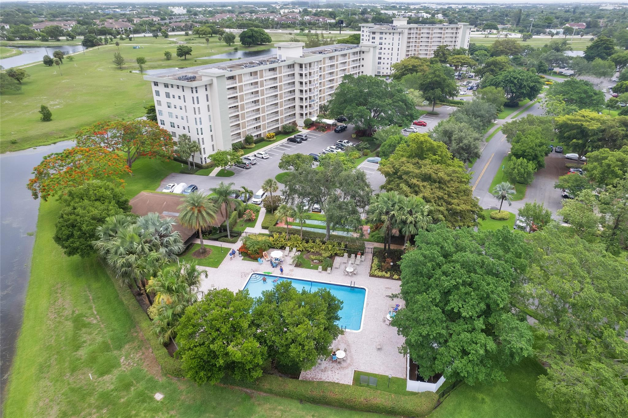3090 North Course Drive, Unit 609 Pompano Beach, FL 33069 - Photo 44 of 44 an aerial view of a house with a yard and lake view