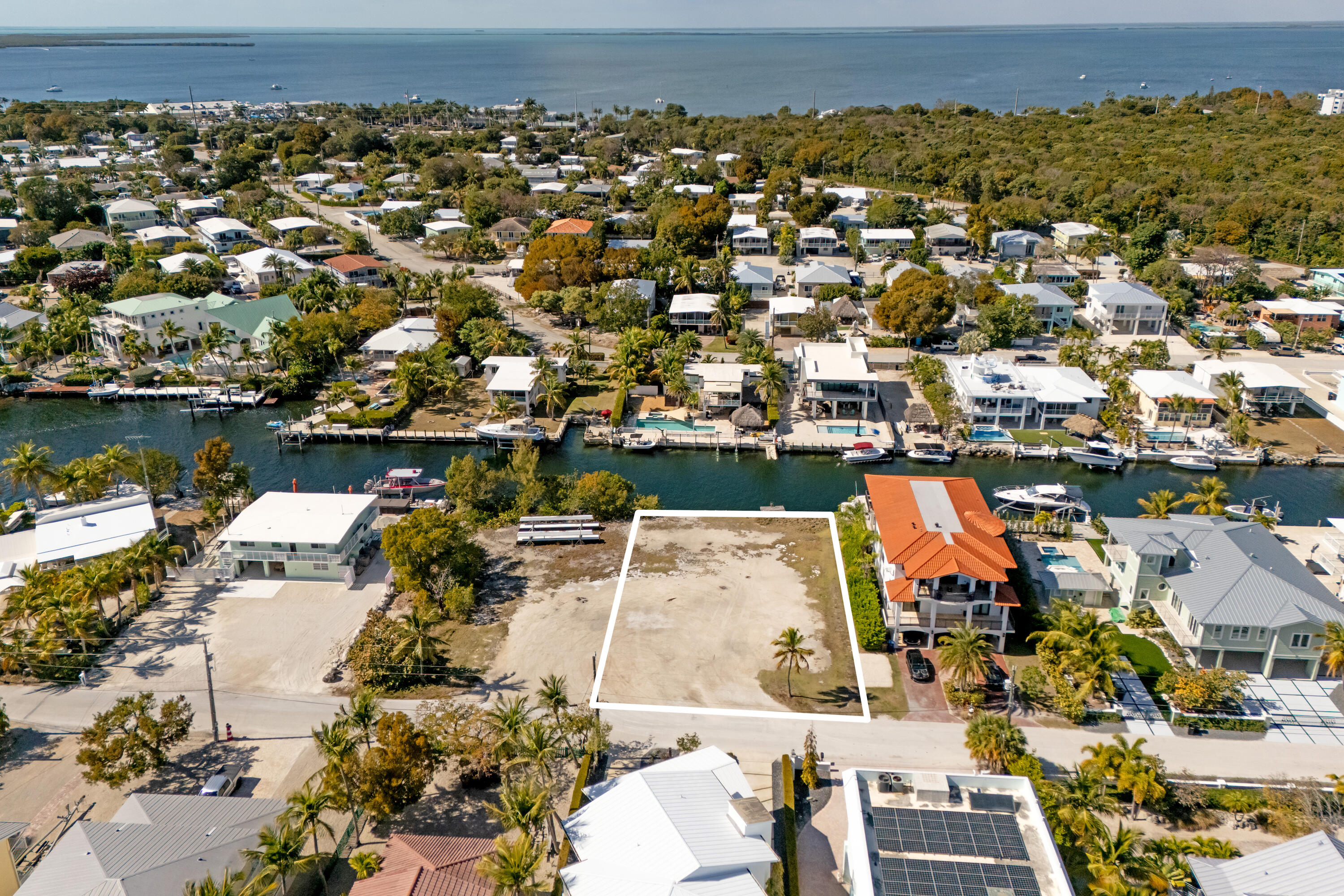 an aerial view of a residential houses with outdoor space