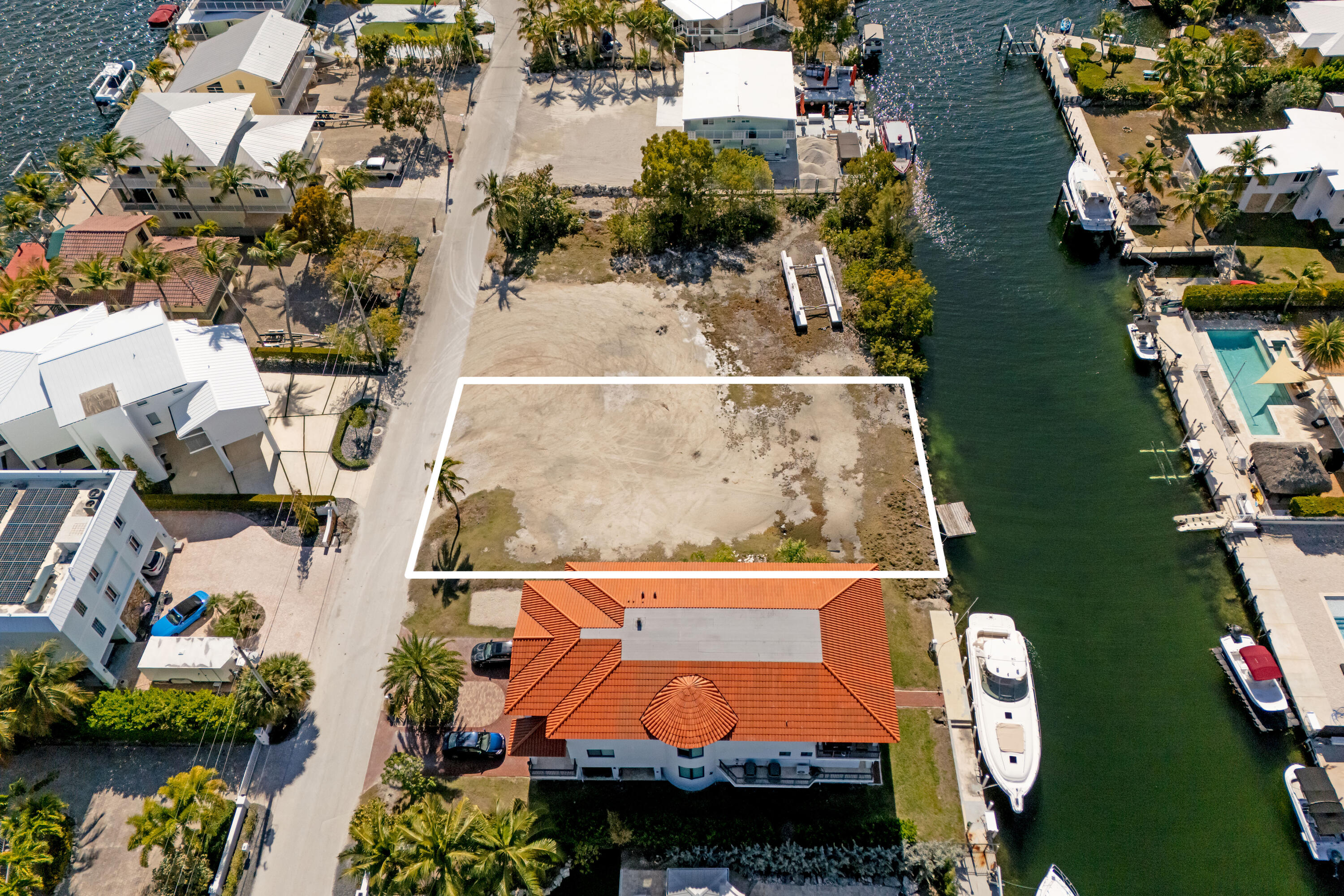 613 Island Drive Key Largo, FL 33037 - Photo 9 of 10 an aerial view of a house with a swimming pool and outdoor seating