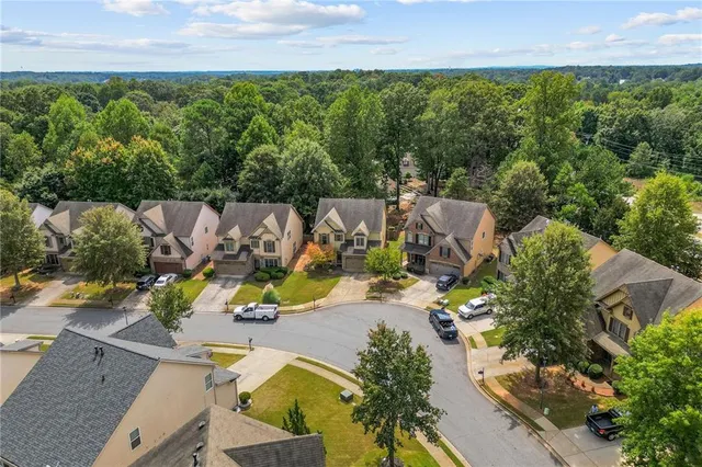 an aerial view of a house with outdoor space
