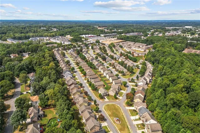 an aerial view of residential building with parking space