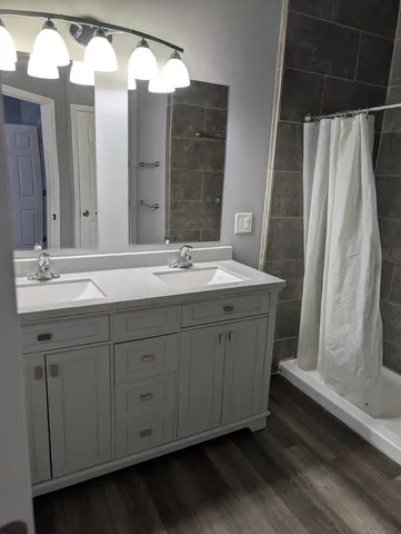 a white toilet sitting next to a bath tub