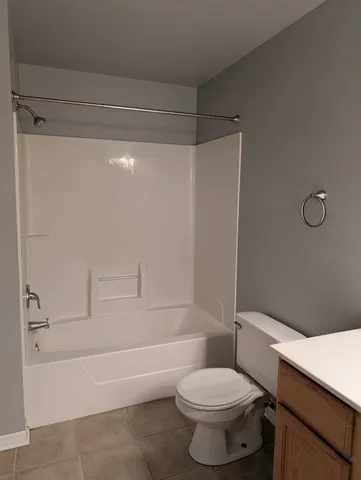 a bathroom with a shower and a tub