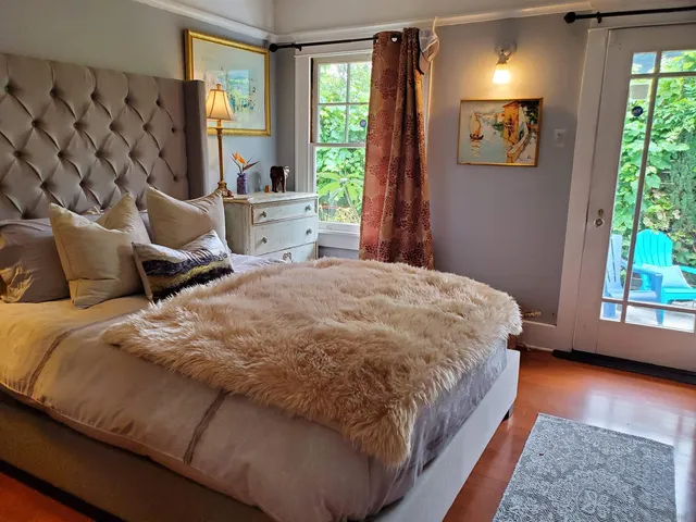 a bed room with a bed and a television