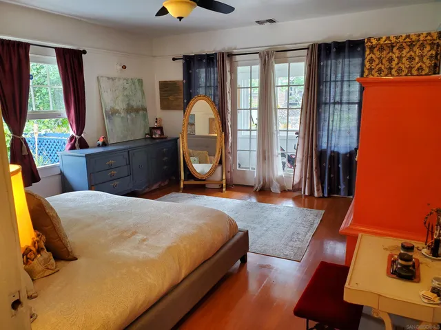 a view of bathroom with a toilet sink and mirror