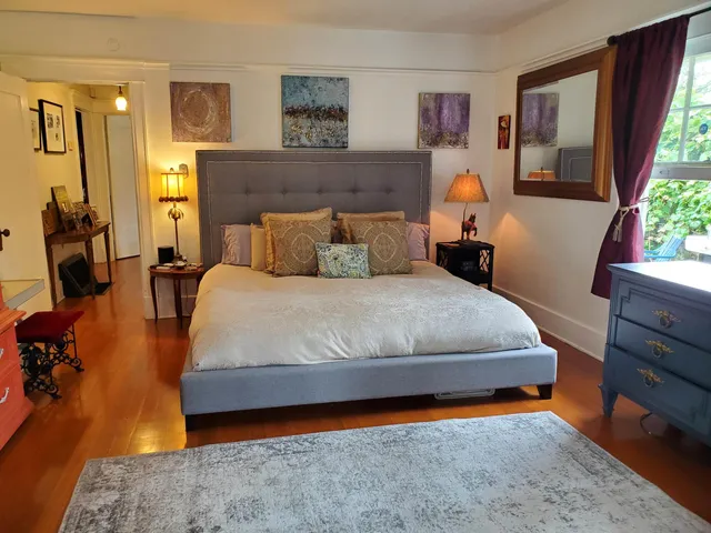 a bathroom with a toilet a sink and a mirror