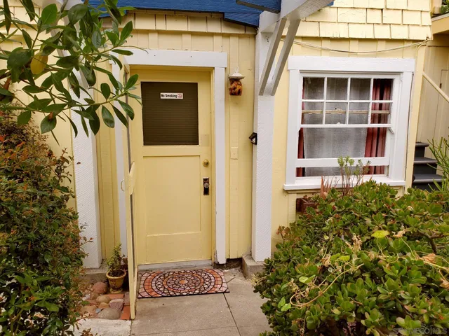 a view of a kitchen with a stove and a window