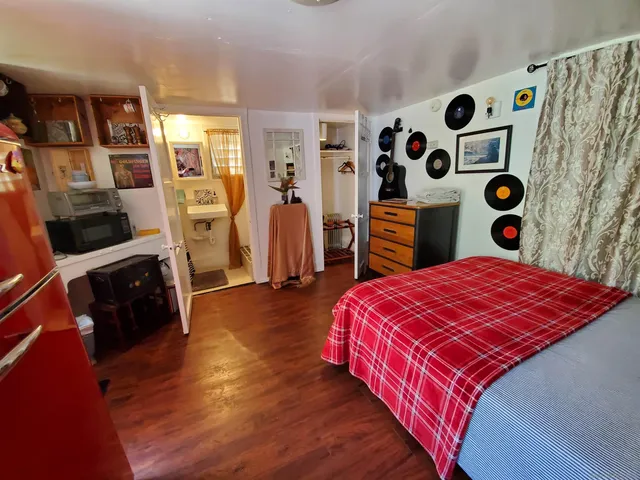 a bedroom with a bed and a window