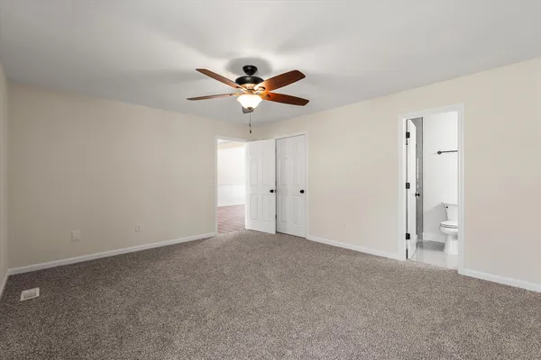 a view of a big room with carpet