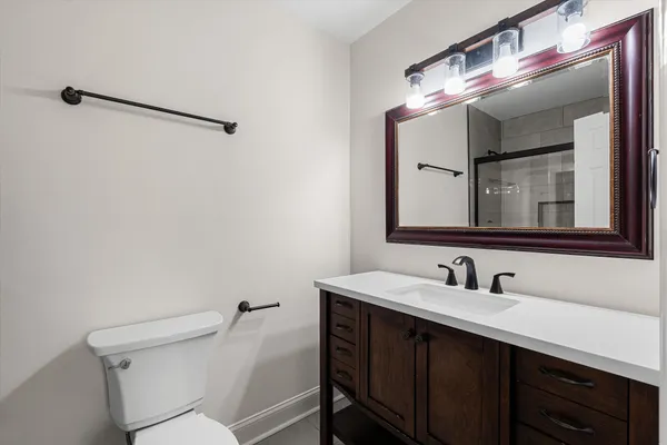 a bathroom with a glass shower door