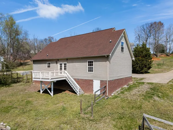 a aerial view of a house with a yard