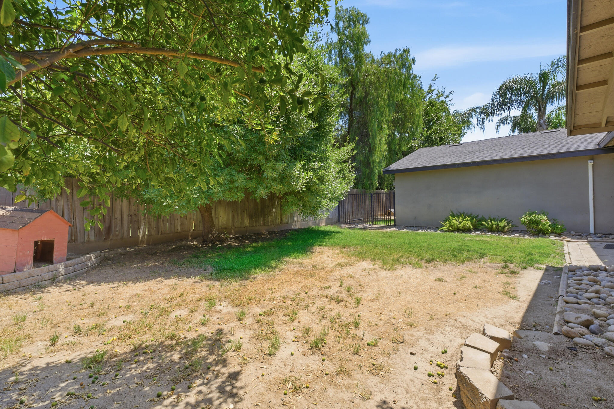 618 Birdsong Court Exeter, CA 93221 - Photo 60 of 62 a backyard of a house with lots of green space