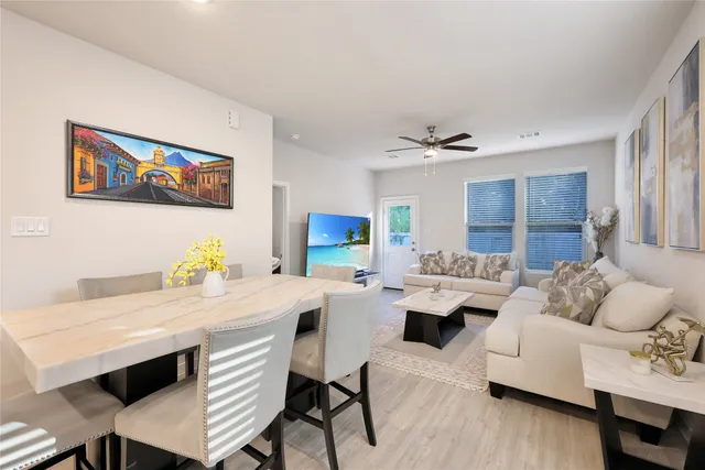 a living room with furniture and a table