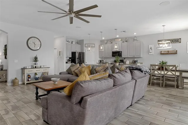 a kitchen with granite countertop a sink a counter space appliances and cabinets
