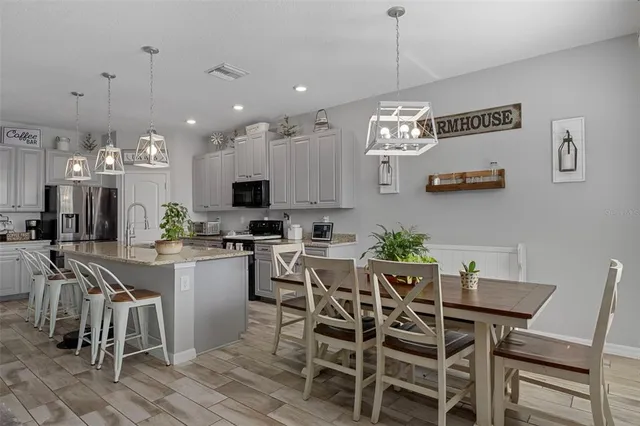 a view of walk in closet with clothes