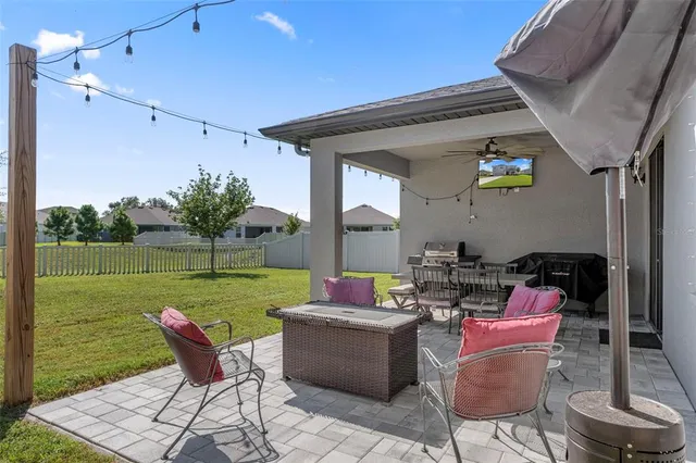 a kitchen with kitchen island granite countertop a sink stainless steel appliances and cabinets