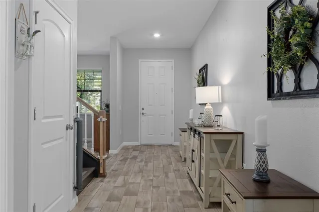 a living room with furniture and a ceiling fan