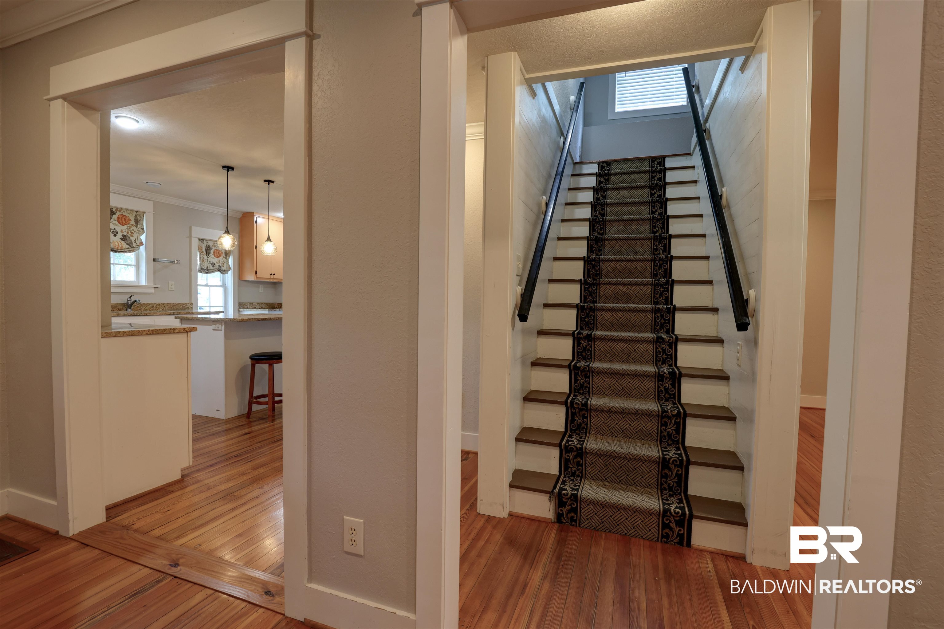 2079 Alabama Street Loxley, AL 36551 - Photo 11 of 42 Stairs featuring crown molding and hardwood / wood-style flooring