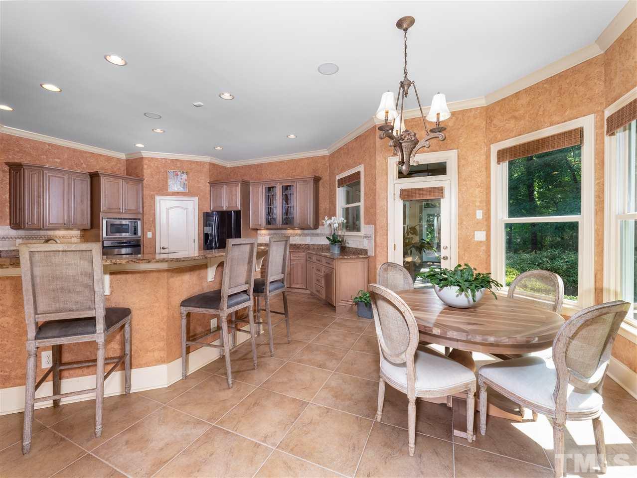 113 Bathgate Lane Cary, NC 27513 - Photo 12 of 30 Large chef's kitchen opens to family room and breakfast nook.