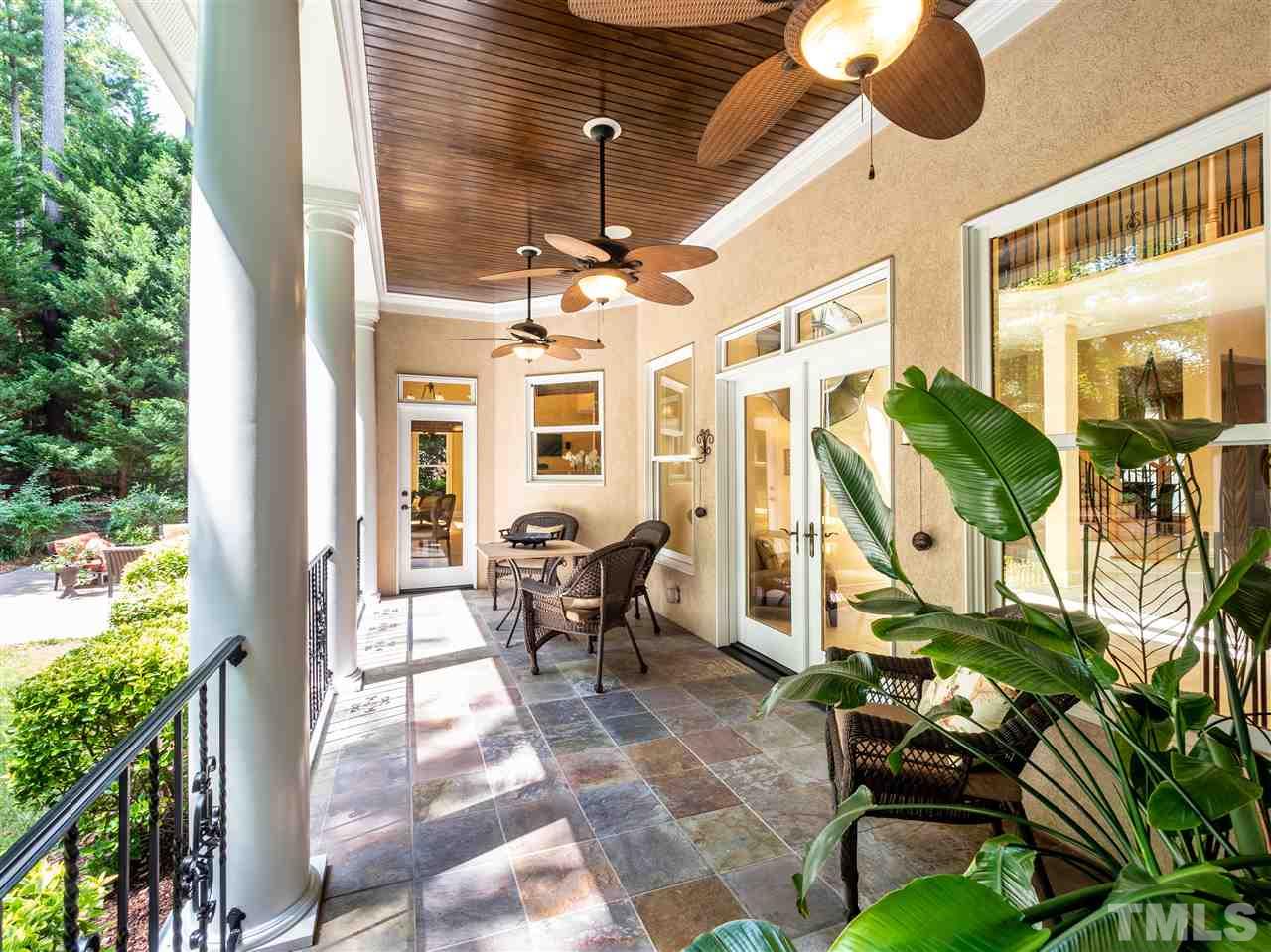 113 Bathgate Lane Cary, NC 27513 - Photo 14 of 30 Easily accessible porch spans the kitchen and gathering area. Remote control screens!