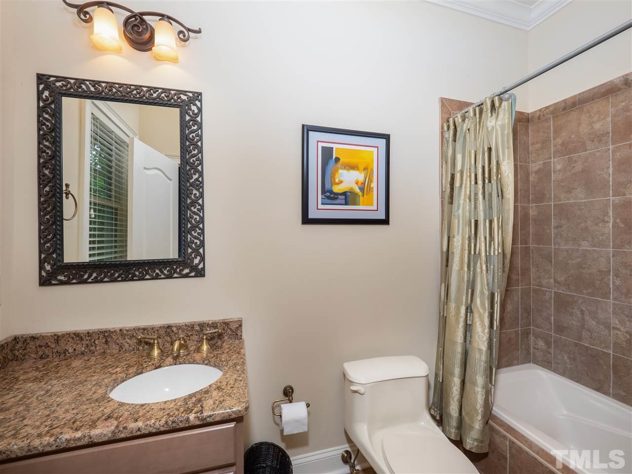 113 Bathgate Lane Cary, NC 27513 - Photo 24 of 30 Obvious attention to detail in all of the ensuite baths. Tiled showers and floors. Granite countertops