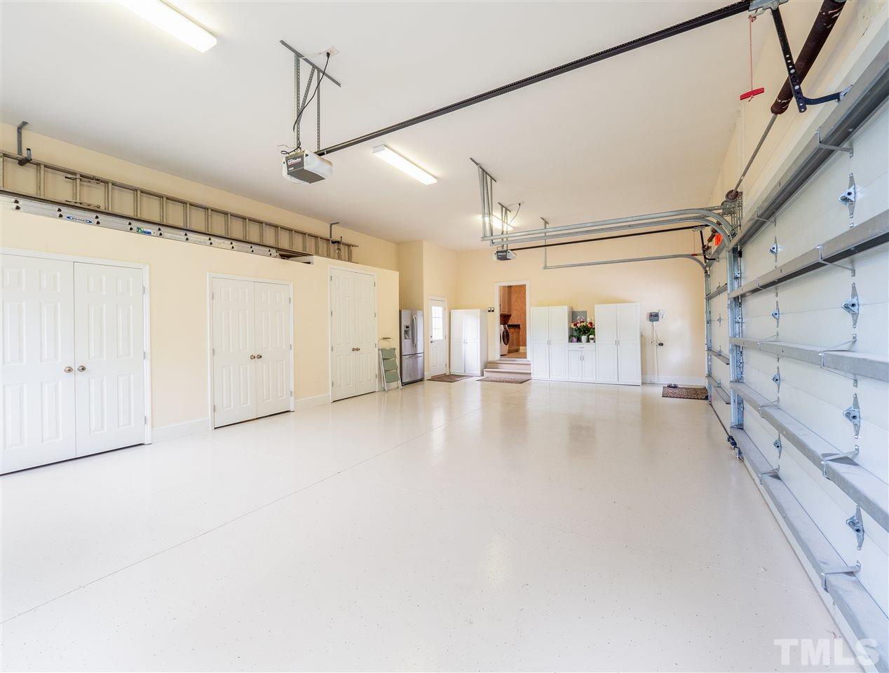 113 Bathgate Lane Cary, NC 27513 - Photo 26 of 30 We had to show off this amazing garage with lots of built in storage and epoxy floor.