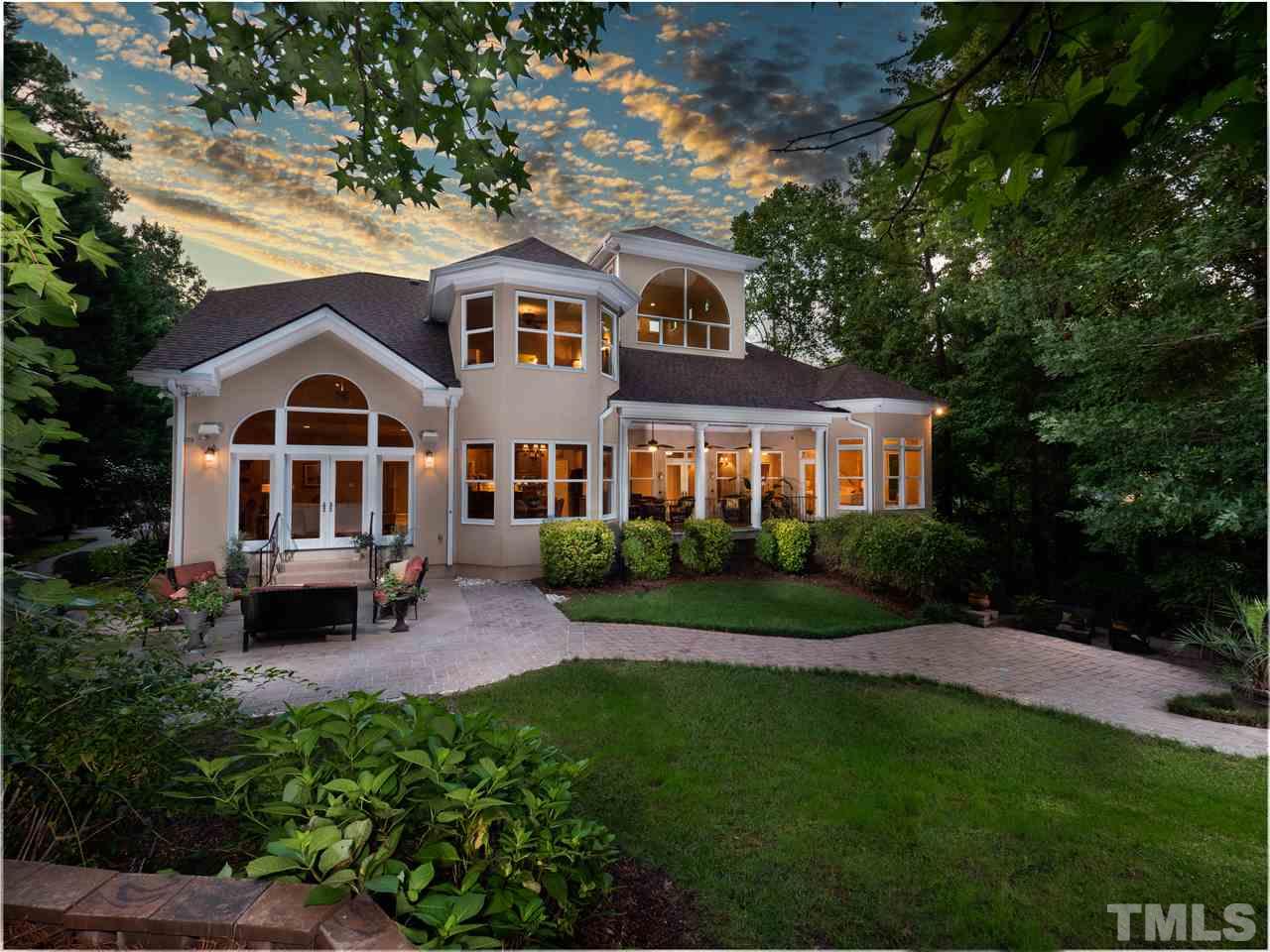 113 Bathgate Lane Cary, NC 27513 - Photo 29 of 30 Sunset.. the magic happens. Soft landscape lighting glows like stars on the ground