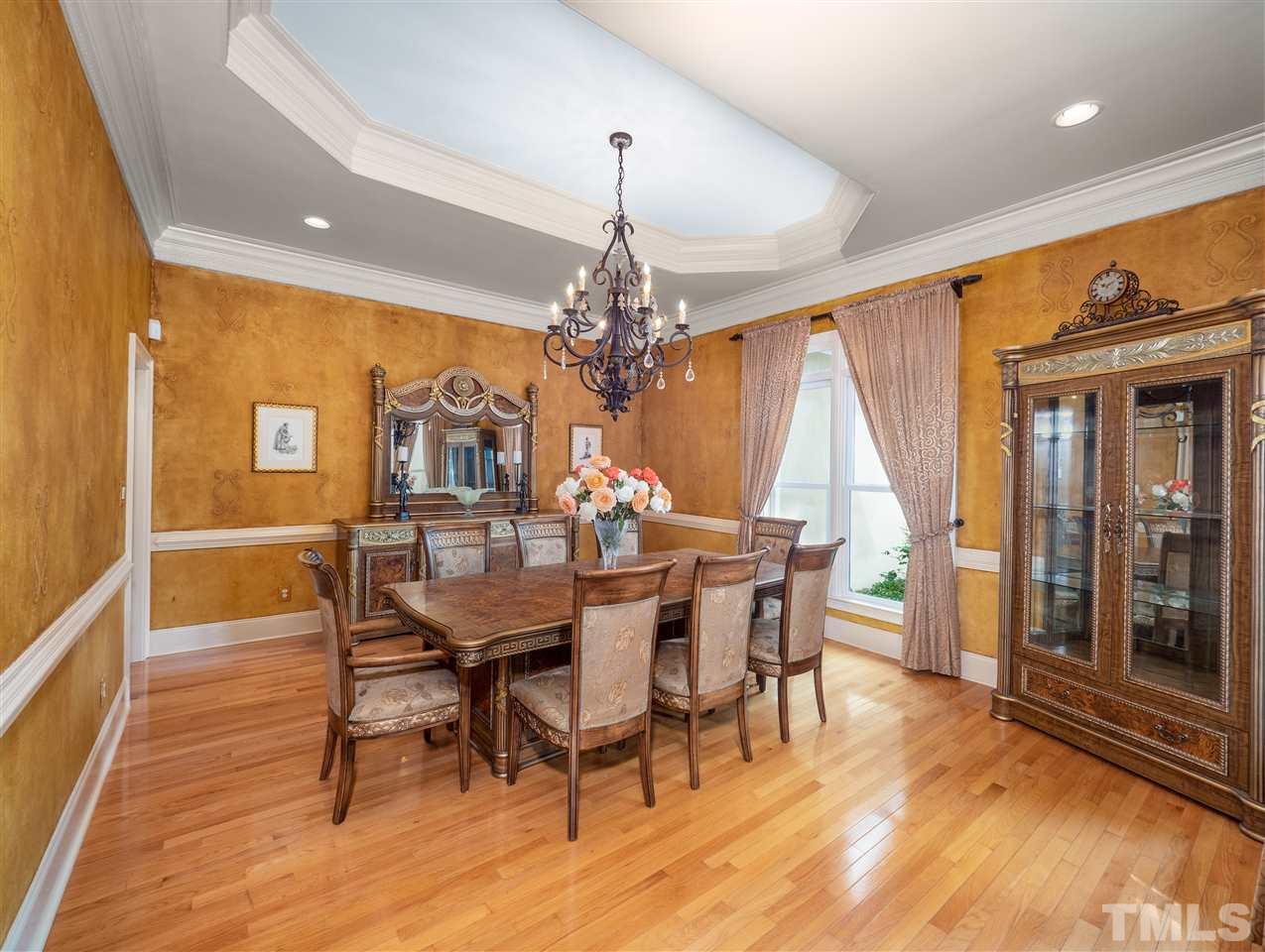 113 Bathgate Lane Cary, NC 27513 - Photo 4 of 30 Plaster wall with artistic medallions add interest to this lovely space
