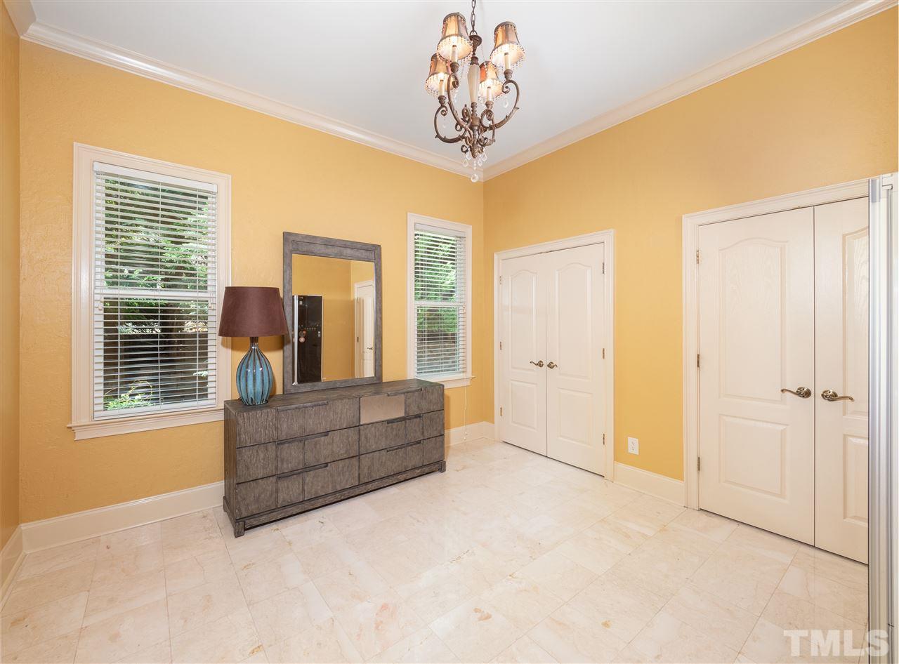 113 Bathgate Lane Cary, NC 27513 - Photo 9 of 30 Main level ensuite bedroom can be an in-law, guest suite or nursery.