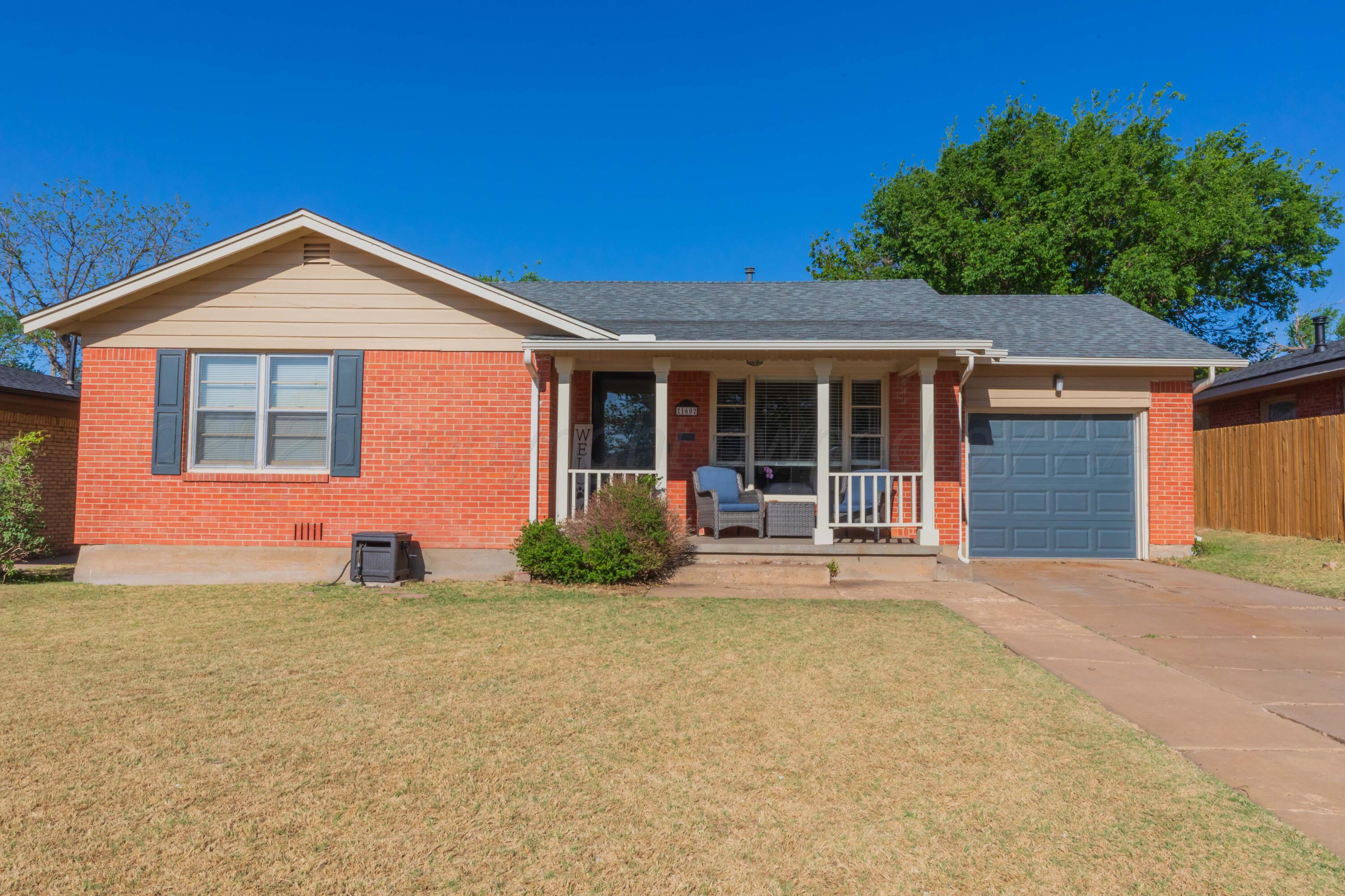 1602 Mustang Street Amarillo, TX 79102 - Photo 2 of 36 front view of a house with a yard