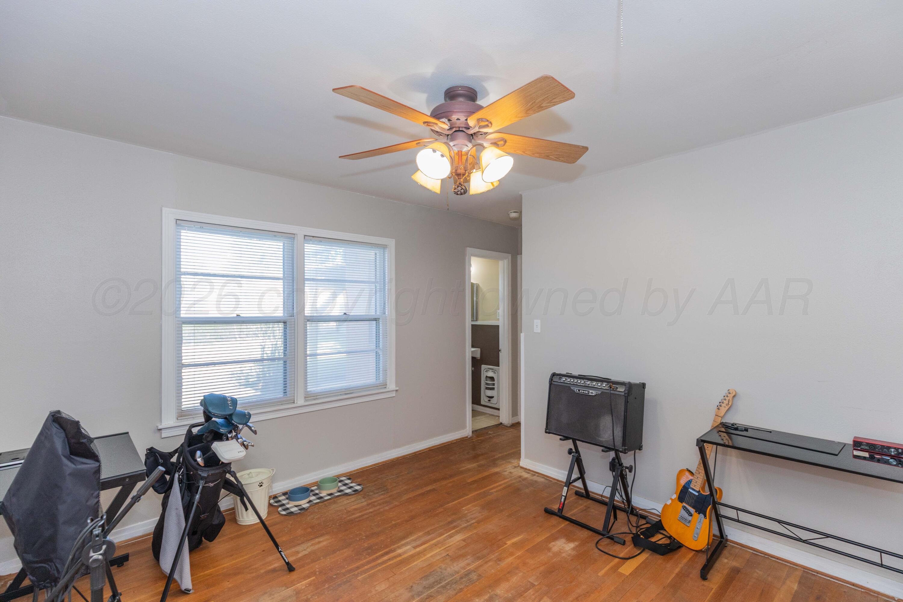 1602 Mustang Street Amarillo, TX 79102 - Photo 25 of 36 a view of a workspace with furniture and a window