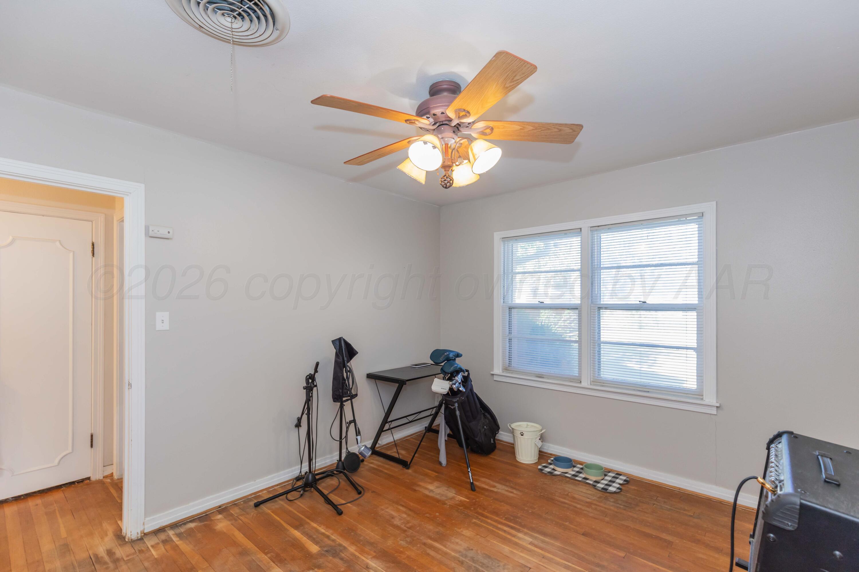 1602 Mustang Street Amarillo, TX 79102 - Photo 26 of 36 a view of a workspace with furniture and a window