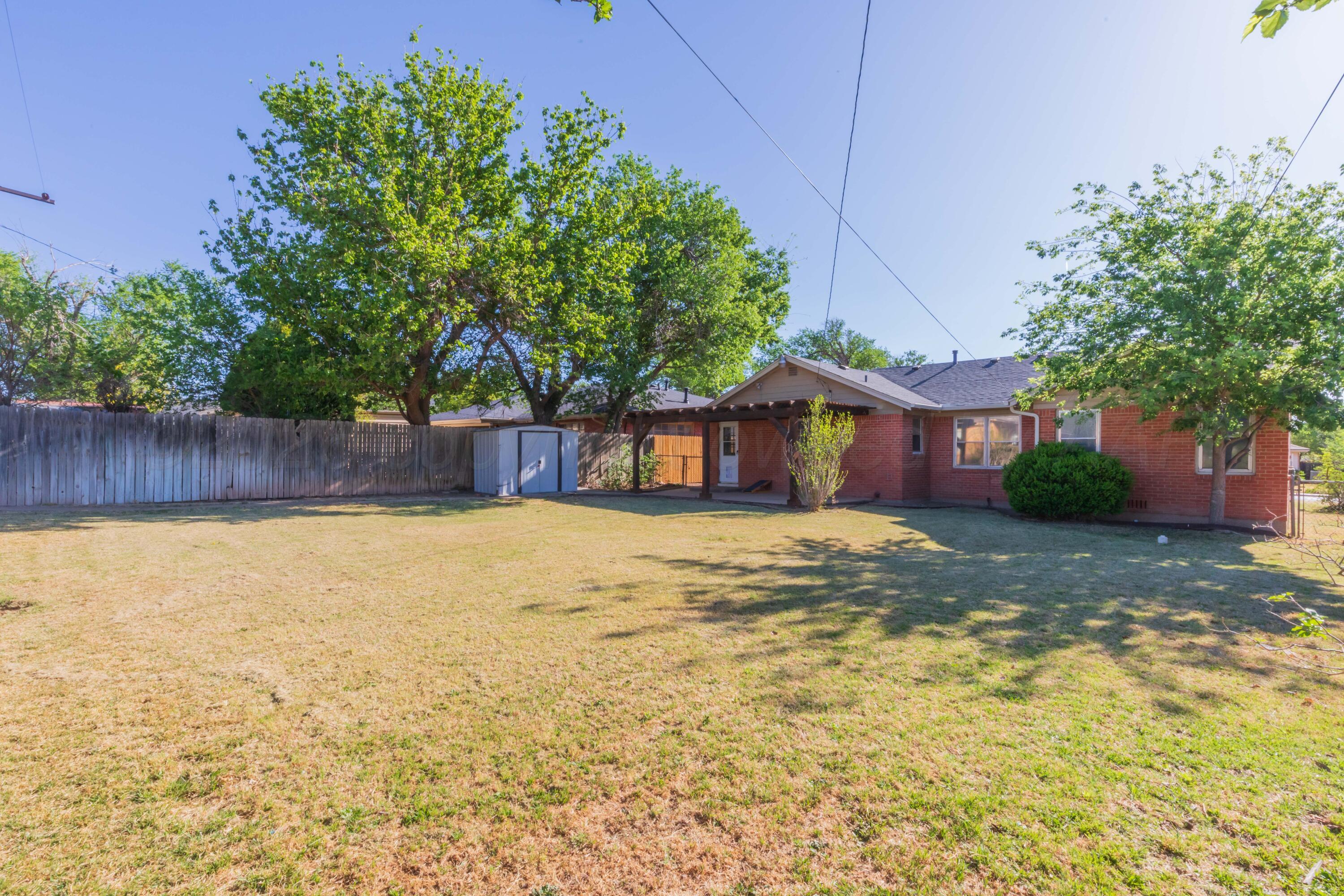 1602 Mustang Street Amarillo, TX 79102 - Photo 33 of 36 a view of a house with a yard