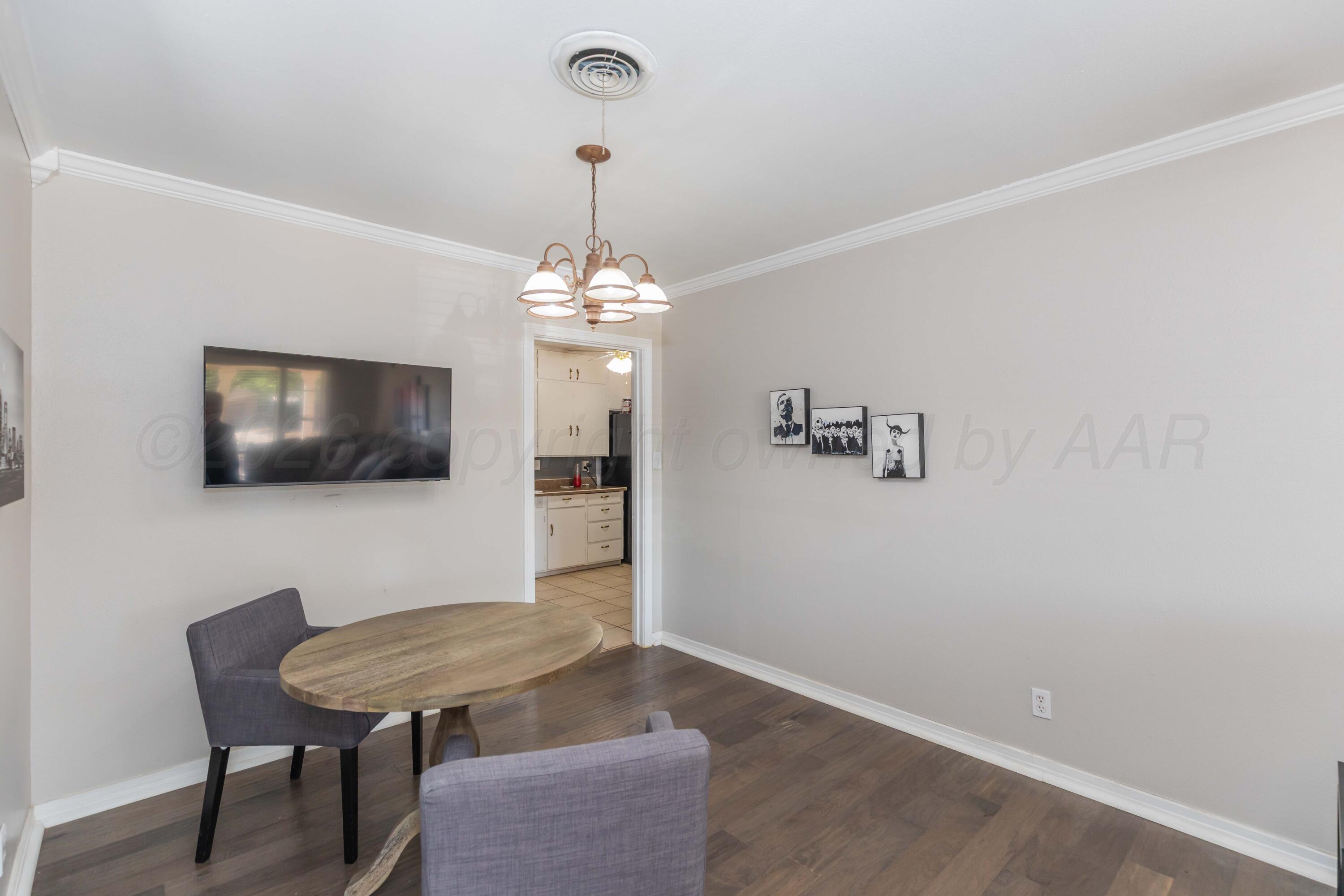 1602 Mustang Street Amarillo, TX 79102 - Photo 10 of 36 a living room with furniture and a flat screen tv