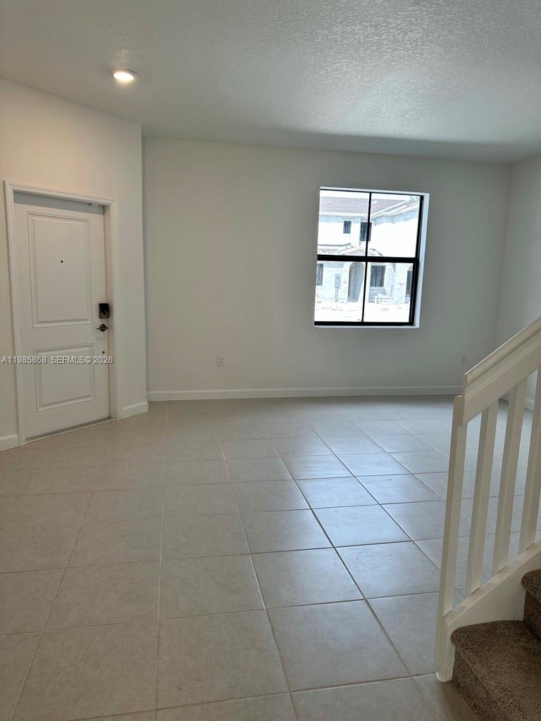 13254 Southwest 285th Street, Unit 13254 Homestead, FL 33033 - Photo 5 of 10 an empty room with windows